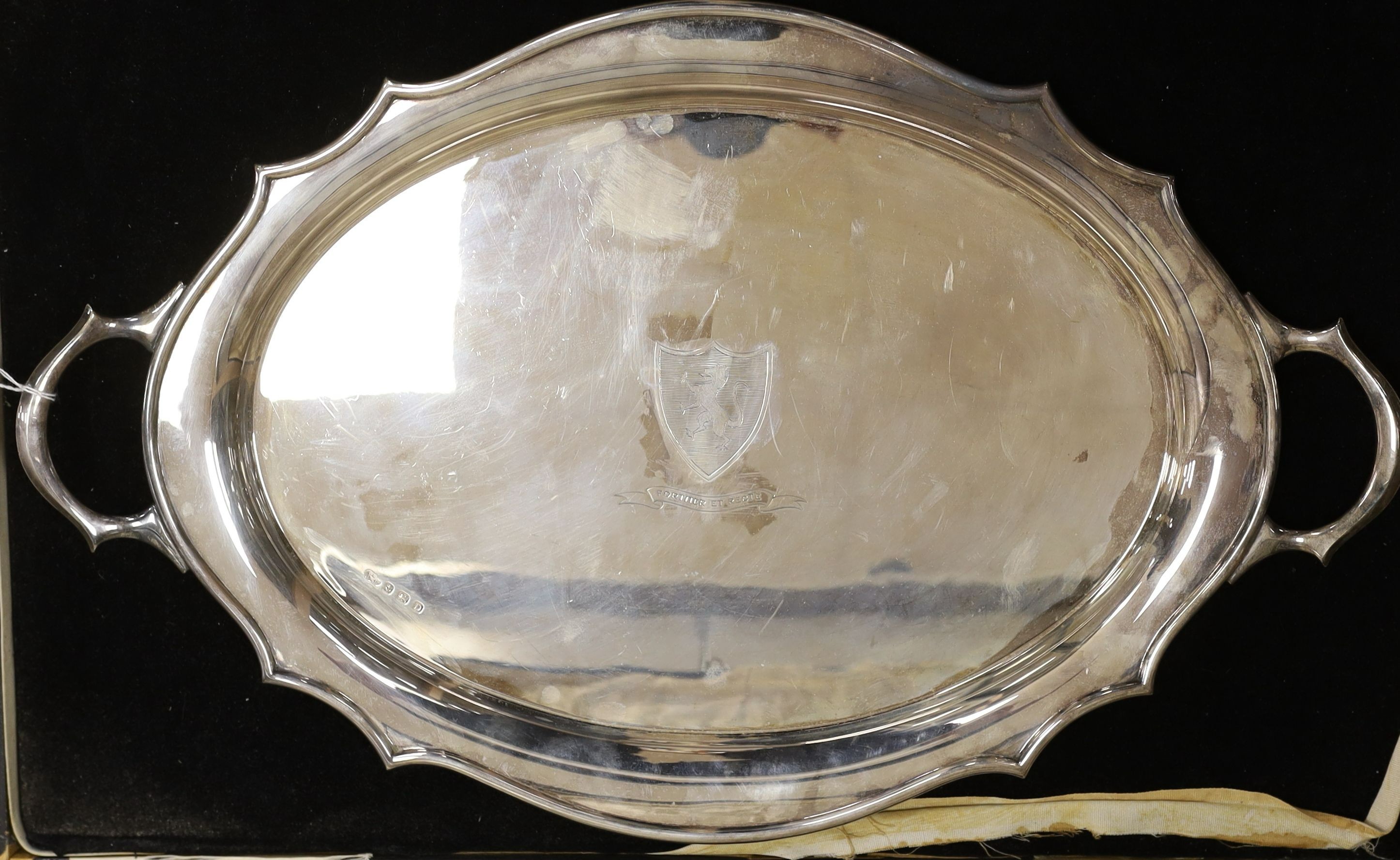 A cased George V silver two handled tea tray, with engraved inscription and crest, Synyer & Beddoes, Birmingham, 1928, 61.2cm, 79oz.